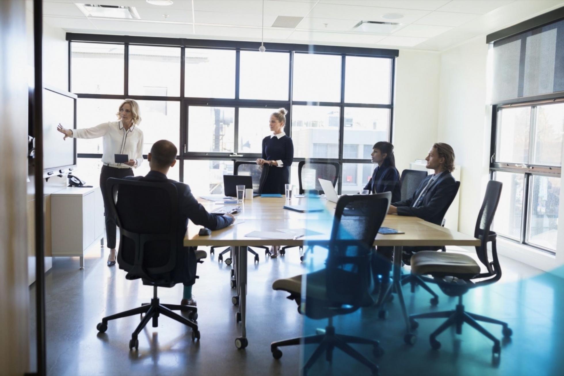 Business financial planning session with documents and analysis tools